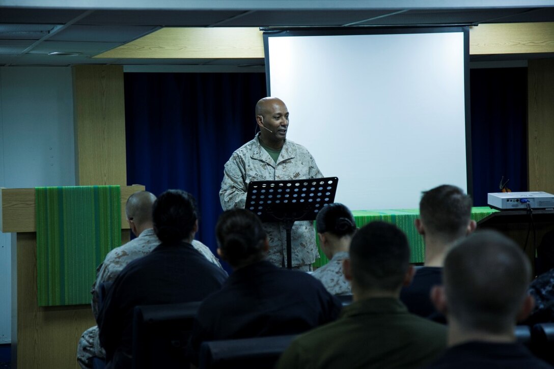 ARABIAN GULF (Sept. 20, 2015) U.S. Navy Cmdr. Samuel Ravelo preaches to Marines and Sailors with the 15th Marine Expeditionary Unit and  Essex Amphibious Ready Group during a contemporary church service aboard the amphibious assault ship USS Essex (LHD 2). Ravelo is the 15th MEU’s chaplain. The 15th MEU is embarked aboard the Essex Amphibious Ready Group and deployed to maintain regional security in the U.S. 5th Fleet area of operations. (U.S. Marine Corps photo by Cpl. Elize McKelvey/Released)