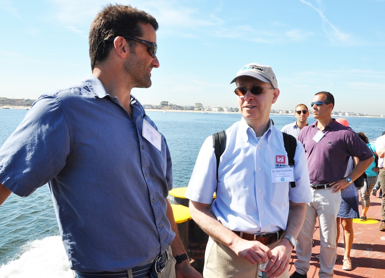 Off the shoreline of Coney Island, N.Y during a Harbor Inspection aboard the DCV Hayward in September 2015. Bill Shaldel (left) CEO of Shadel Environmental, speaks with Paul Tumminello, Chief of New York District’s Civil Works Branch, as Anthony Ciorra, Chief of Coastal Restoration Branch looks on.