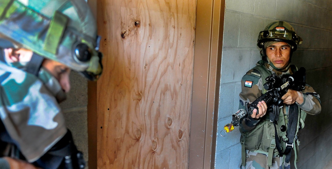 U.S. and Indian soldiers provide security before entering a room during the exercise Yudh Abhyas 2015 on Joint Base Lewis-McChord, Wash., Sept. 21, 2015. U.S. Army photo by Sgt. Daniel Schroeder