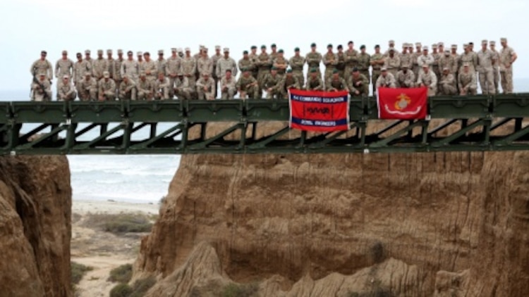 Engineers from Bridge Company, 7th Engineer Support Battalion, 1st Marine Logistics Group and 1st Combat Engineer Battalion, 1st Marine Division as well as members of British 54 Commando Squadron Royal Engineers stand atop a medium girder bridge they built at Marine Corps Base Camp Pendleton, Calif., Sept. 23, 2015. Marines from 7th ESB and 1st CEB are conducting various engineer training events alongside their British counterparts in coming weeks as part of annual large-scale exercise Black Alligator.

