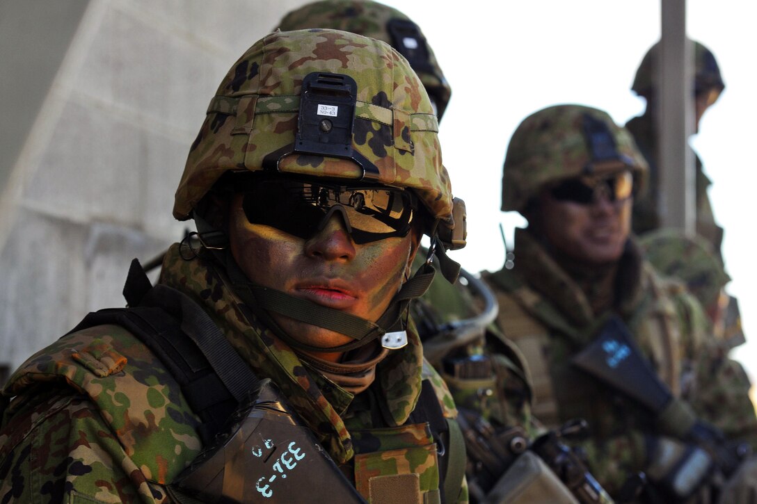 Japanese soldiers prepare to assault a village during the culminating live-fire exercise of Rising Thunder at Yakima Training Center, Wash., Sept. 21, 2015. The Japanese soldiers are assigned to the Japan Ground Self-Defense Force. U.S. Army photo by Sgt. Eliverto Larios