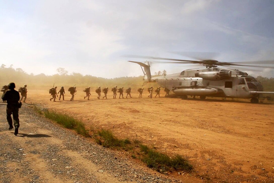 U.S. Marines board a CH-53E Super Stallion helicopter during airlift operations as part of Forest Light on Camp Imazu in Takashima, Japan, Sept. 15, 2015. Forest Light is a semiannual, bilateral exercise conducted by elements of the III Marine Expeditionary Force and the Japan Ground Self-Defense Force. U.S. Marine Corps photo by Cpl. Devon Tindle