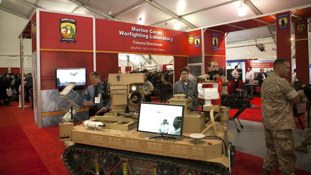 Marines and guests tour the Marine Corps Warfighting Labratory booth during the 2015 Modern Day Marine Military Expo at Marine Corps Base Quantico, Va., Sept. 22, 2015. The expo is focusing on enhanced capabilities for expeditionary forces and is happening Sept. 22-24. 