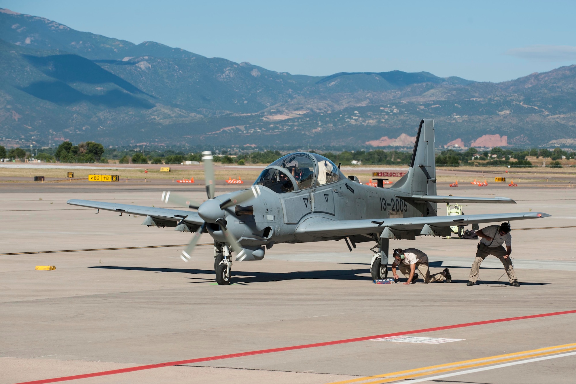 Afghan maintainers check over an A-29B Super Tucano before taking off for high-altitude training Sept. 16, 2015, at Peterson Air Force Base, Colo. Pilots with the 81st Fighter Squadron out of Moody Air Force Base, Ga., have been training with Afghan pilots since January and came to Peterson to train in the high-altitude and mountainous terrain. After the Afghan pilot training is complete, they will go back to Afghanistan to establish their own fighter squadron. (U.S. Air Force photo/Airman 1st Class Rose Gudex)