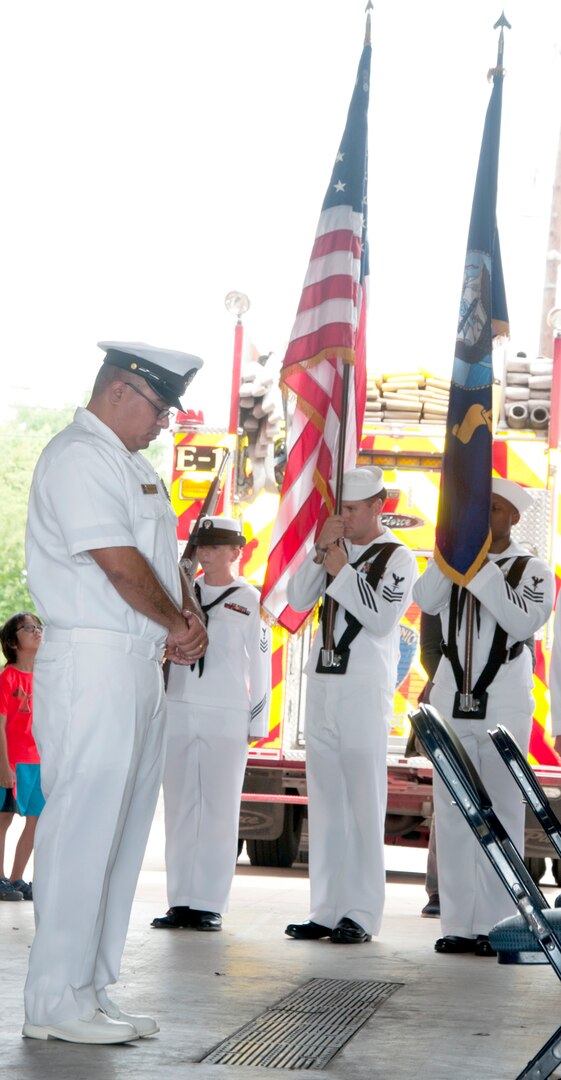 Sailors bow their heads during the invocation at a 9/11 commemoration ceremony Sept. 11 at San Antonio Fire Station 1