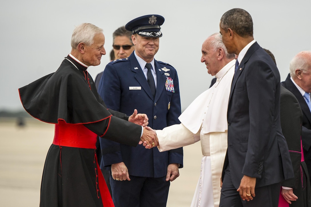 President Barack Obama, right, escorts Pope Francis, who greets Cardinal Donald W. Wuerl, left, archbishop of Washington, and Air Force Maj. Gen. Darryl Burke, District of Washington commander, on Joint Base Andrews, Md., Sept. 22, 2015. This marks the first visit by the current pope to the United States. U.S. Air Force photo by Tech. Sgt. Robert Cloys