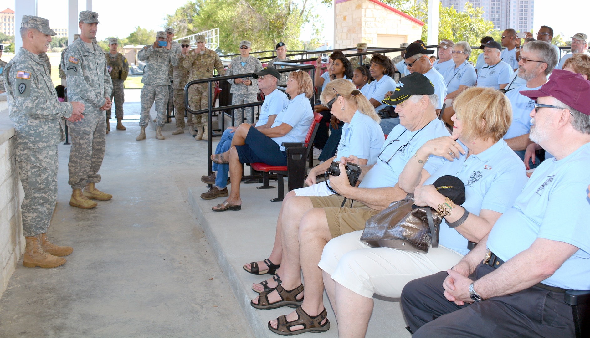 Maj. Gen. Steve Jones (left), commanding general, US Army Medical Department Center and School, US Army Health Readiness Center of Excellence and Sgt. Maj. Andrew Rhoades, AMEDDC&S, HRCoE,  welcome Vietnam War era medics, who served with Company C, 23rd Medical Battalion, Americal Division, to Fort Sam Houston and thank them for their legacy and contributions taking care of wounded comrades during the Vietnam War. 