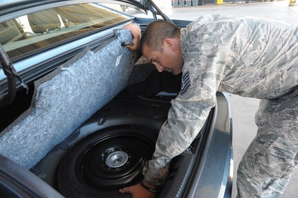Tech. Sgt. James Mckinney, 502nd Logistics Readiness Squadron vehicle operator dispatcher, performs a daily safety inspection Sept. 23, 2015 at Joint Base San Antonio-Randolph.  The 502nd LRS provides transportation support for events such as official business, mobility exercises and deployments.  (U.S. Air Force photo by Joel Martinez/Released)