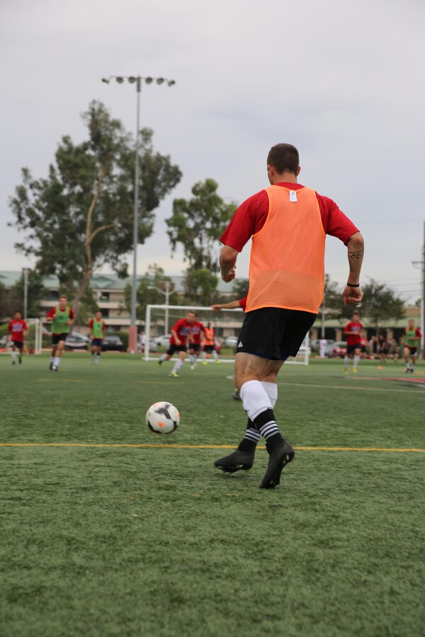 A service member with the U.S. Men’s Armed Forces Soccer Team prepares to kick a soccer ball during a practice session aboard Marine Corps Air Station Miramar, Calif., Sept. 21. The team consists of men from all branches of the U.S. military and is scheduled to play in the World Military Games in South Korea. (U.S. Marine photo by Lance Cpl. Kimberlyn Adams/Released)