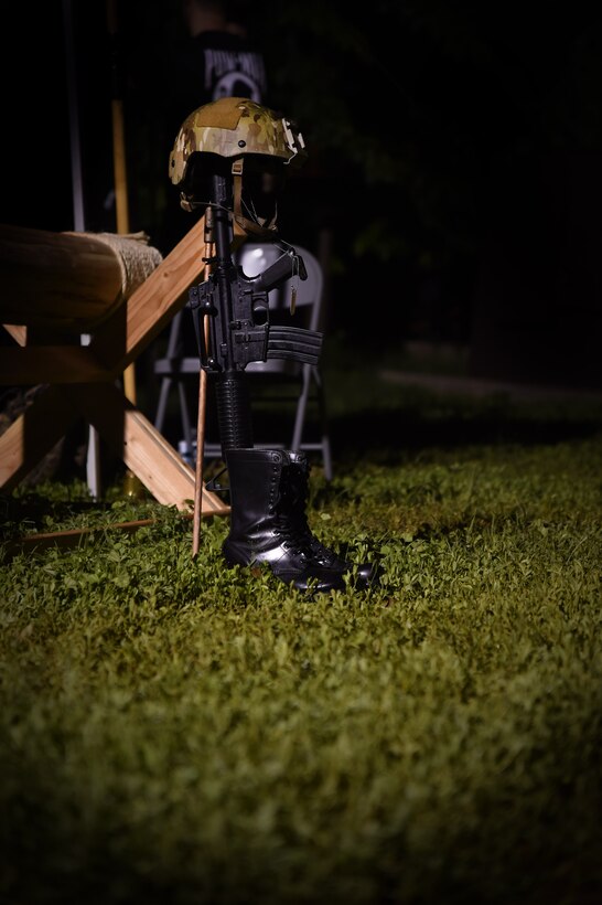 The fallen warrior battle crosses rests at Earhart track during the 24 hour Prisoner of War and Missing In Action remembrance run on Joint Base Pearl Harbor-Hickam, Hawaii, Sept. 18, 2015. The fallen warrior battle crosse is a symbol that represents the sacrifices and service of military members. Every year the nation pauses on the third Friday of September to remember 83,344 Americans still unaccounted-for across the Defense Department. (U.S. Air Force photo by Tech. Sgt. Aaron Oelrich/Released)   