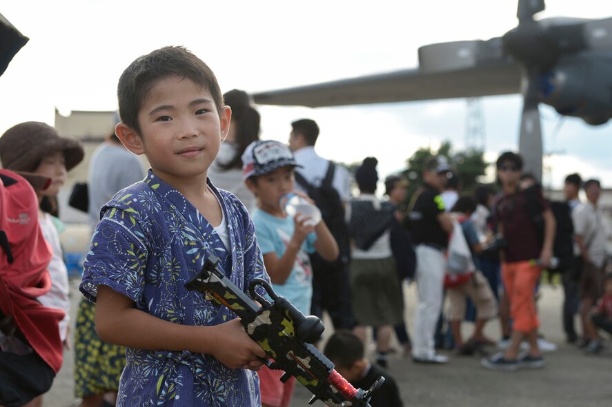 A boy holds a plastic gun during the 2015 Japanese-American Friendship Festival at Yokota Air Base, Japan, Sept. 20, 2015. More than 185,000 people attended the annual festival. (U.S. Air Force photo by Staff Sgt. Cody H. Ramirez/Released)