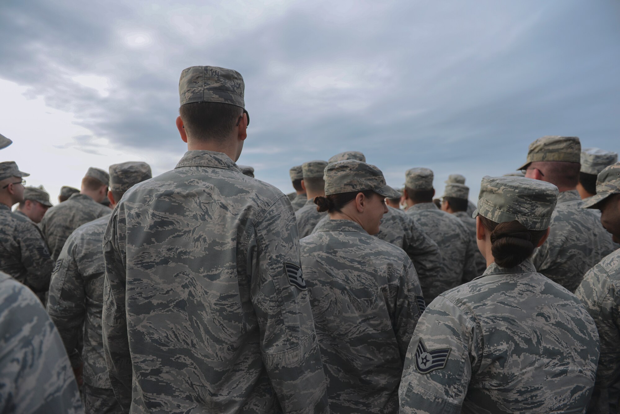 Airmen gather for a foreign object debris walk Sept. 21, 2015, at Yokota Air Base, Japan. FOD is any object potentially harmful to an aircraft, ranging from bolts, screws and other metal pieces, to rocks, paper and plastic. FOD can cost the Air Force millions of dollars in avoidable aircraft damage. (U.S. Air Force photo by Airman 1st Class Delano Scott/Released)