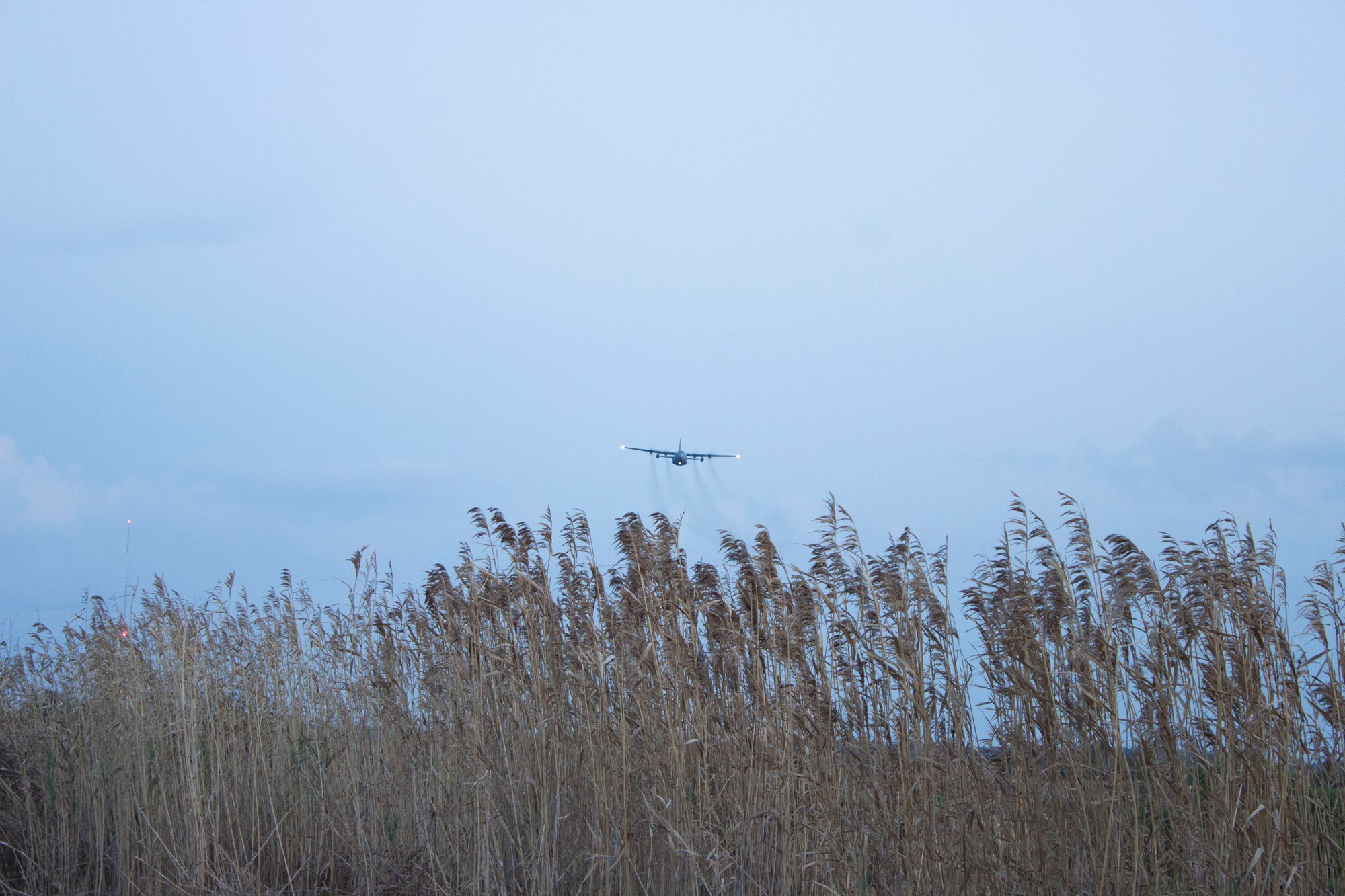 ‘Spray zero eight’ team performs an aerial spray mission to eliminate mosquitoes over the dredge spoils of Joint Base Charleston, South Carolina. (U.S. Air Force Photo/Susan Lawson/Released)