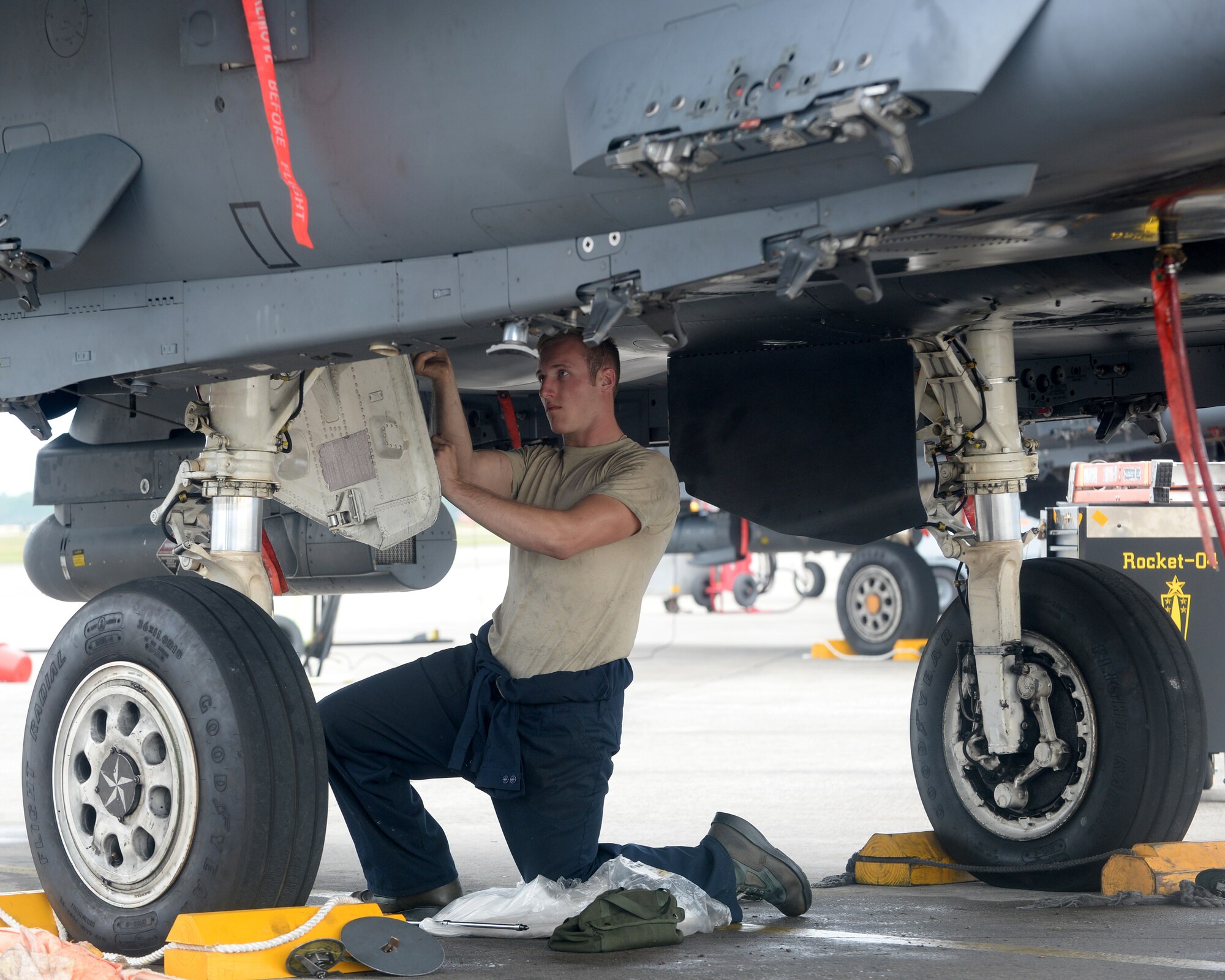Staff Sgt. Cody M. Messinger, 336th Aircraft Maintenance Unit dedicated crew chief from Seymour-Johnson Air Force Base, N.C., works on a U.S. Air Force F-15E Eagle fighter jet.  F-15Es from the 336th Fighter Squadron at Seymour-Johnson AFB were sent to Tyndall for the Weapons System Evaluation Program hosted by the 53rd Weapons Evaluation Group.  Squadrons that participate in the evaluation are put through simulations to test the weapons systems of their fighters. (U.S. Air Force photo by Airman 1st Class Cody R. Miller/Released)