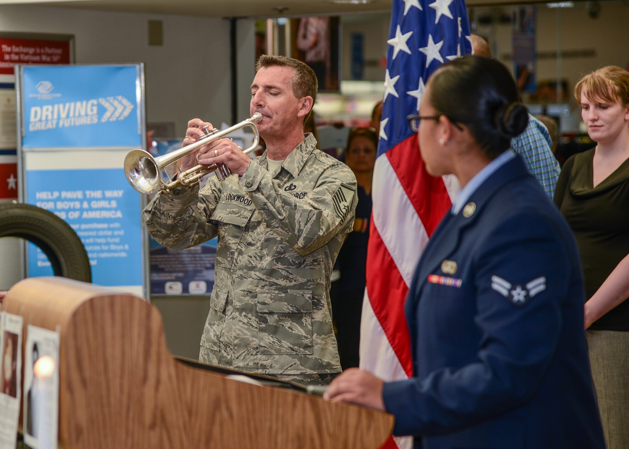 Master Sgt. Gerald Lockwood, 772nd Test and Evaluation Squadron, played “America the Beautiful” in honor of all POW/MIAs in the lobby of the Exchange Sept. 18. (U.S. Air Force photo by Rebecca Amber)