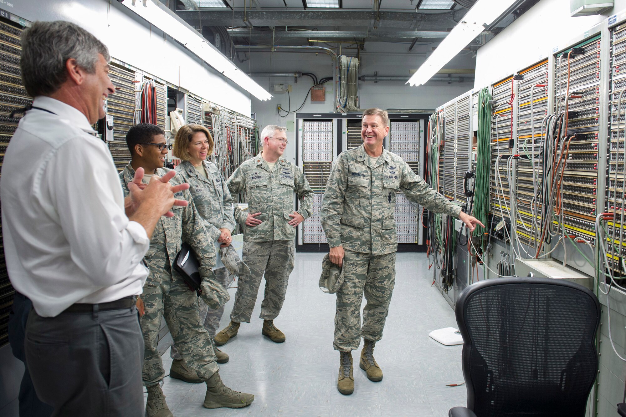 Brig. Gen. Wayne Monteith, 45th Space Wing commander, discusses range communications equipment with members of the Operations Group at the XY building of Cape Canaveral Air Force Station, Florida. The wing commander met with the personnel from 45th OG and was introduced to the facilities they use in day-to-day operations. (U.S. Air Force photo by Matthew Jurgens/Released)