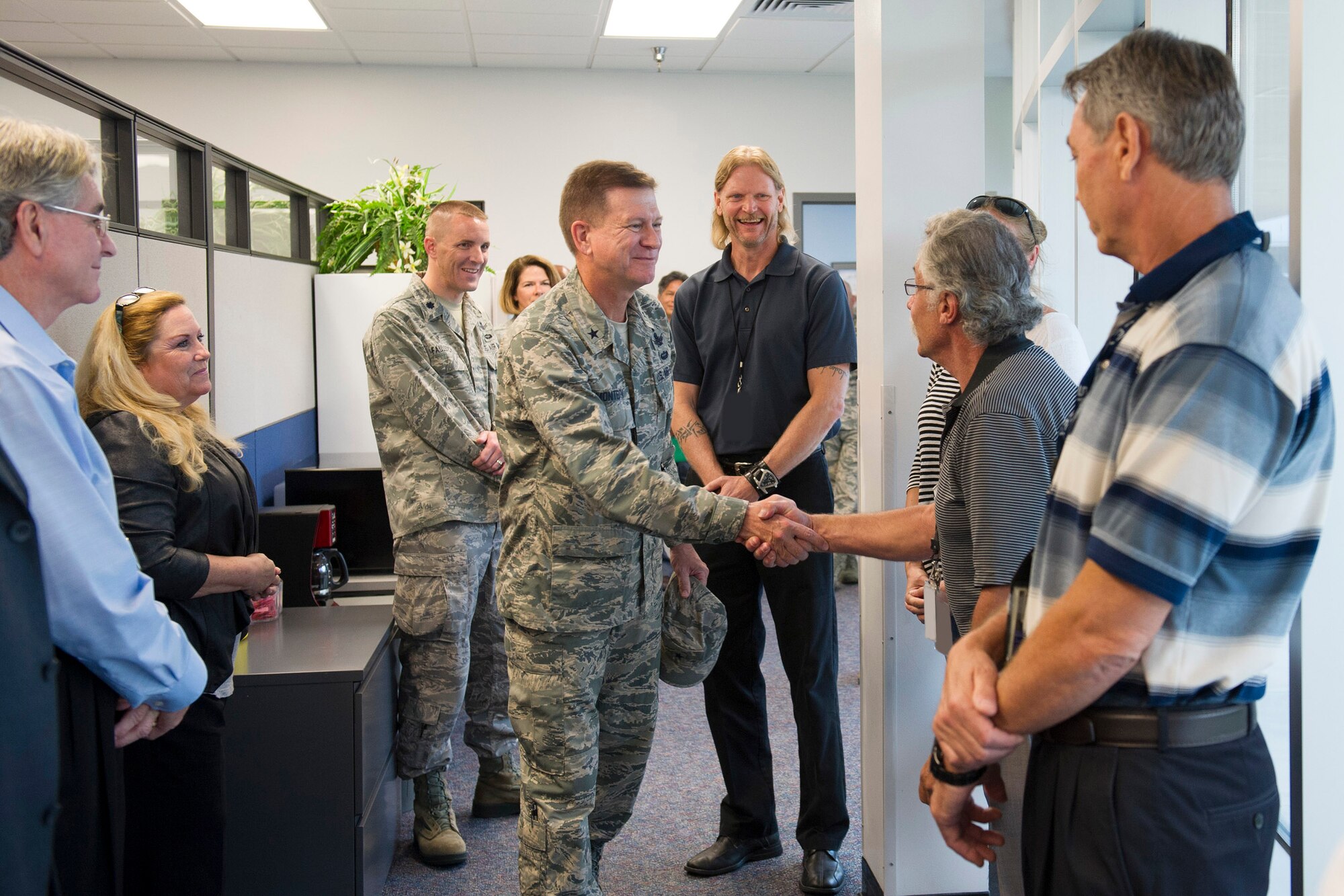 Brig. Gen. Wayne Monteith, 45th Space Wing commander, greets members of the 1st Range Operations Squadron Sept. 22, 2015, at the Morrell Operations Center on Cape Canaveral Air Force Station, Florida. The wing commander met with the personnel from 45th OG and was introduced to the facilities they use in day-to-day operations. (U.S. Air Force photo by Matthew Jurgens/Released)