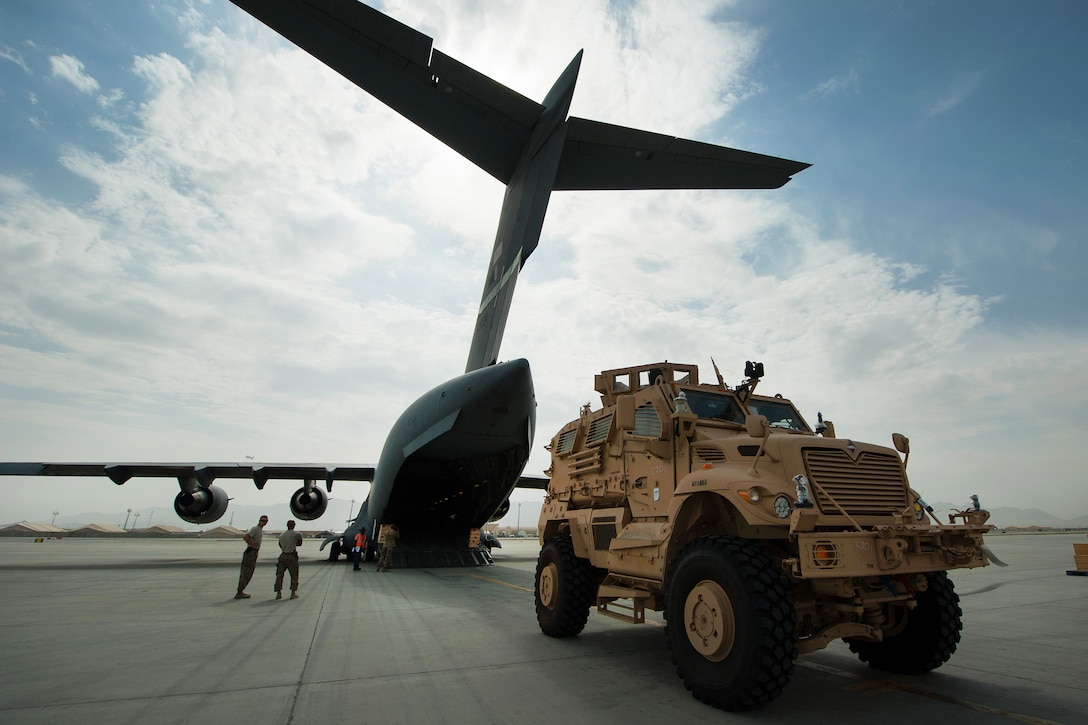A U.S. Army mine-resistant, ambush-protected vehicle offloads from an Air Force C-17 Globemaster III aircraft on Bagram Airfield, Afghanistan, Sept. 21, 2015. U.S. Air Force photo by Tech. Sgt. Joseph Swafford