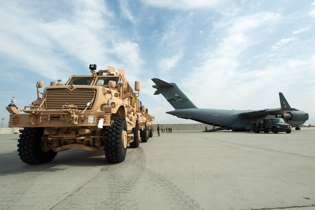 U.S. Army mine-resistant, ambush-protected vehicles offload from an Air Force C-17 Globemaster III aircraft on Bagram Airfield, Afghanistan, Sept. 21, 2015. U.S. Air Force photo by Tech. Sgt. Joseph Swafford