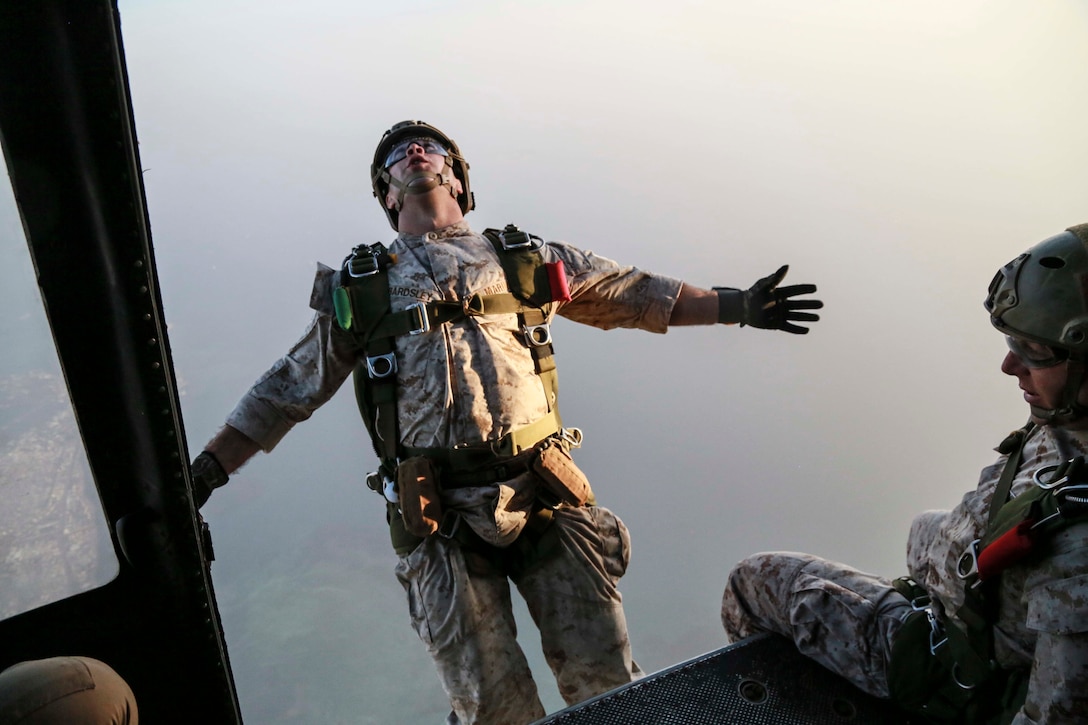U.S. Marine Sgt. Nick Bardsley parachutes out of a UH-1Y Venom from Marine Medium Tiltrotor Squadron 161 (Reinforced) in Camp Lemonnier, Djibouti on Sept. 16, 2015. Bardsley is a point man with the 15th Marine Expeditionary Unit’s Force Reconnaissance Detachment. Elements of the 15th MEU are conducting bilateral training with the 5th Overseas Combined Arms Regiment (RIAOM) and French paratroopers in Djibouti in order to improve interoperability between the MEU and the French military. (U.S. Marine Corps photo by Sgt. Steve H. Lopez/Released)