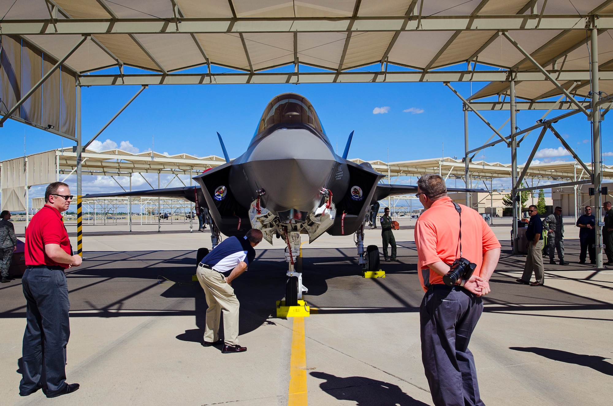Civic leaders from Team Dover take a look at a parked F-35 Lightning II fighter jet, Sept. 16, 2015, on Luke Air Force Base, Arizona. CRTs are designed to engage local leaders from the Dover community with unique missions from different military bases outside of the Air Mobility Command. (U.S. Air Force photo by Capt. Bernie Kale)