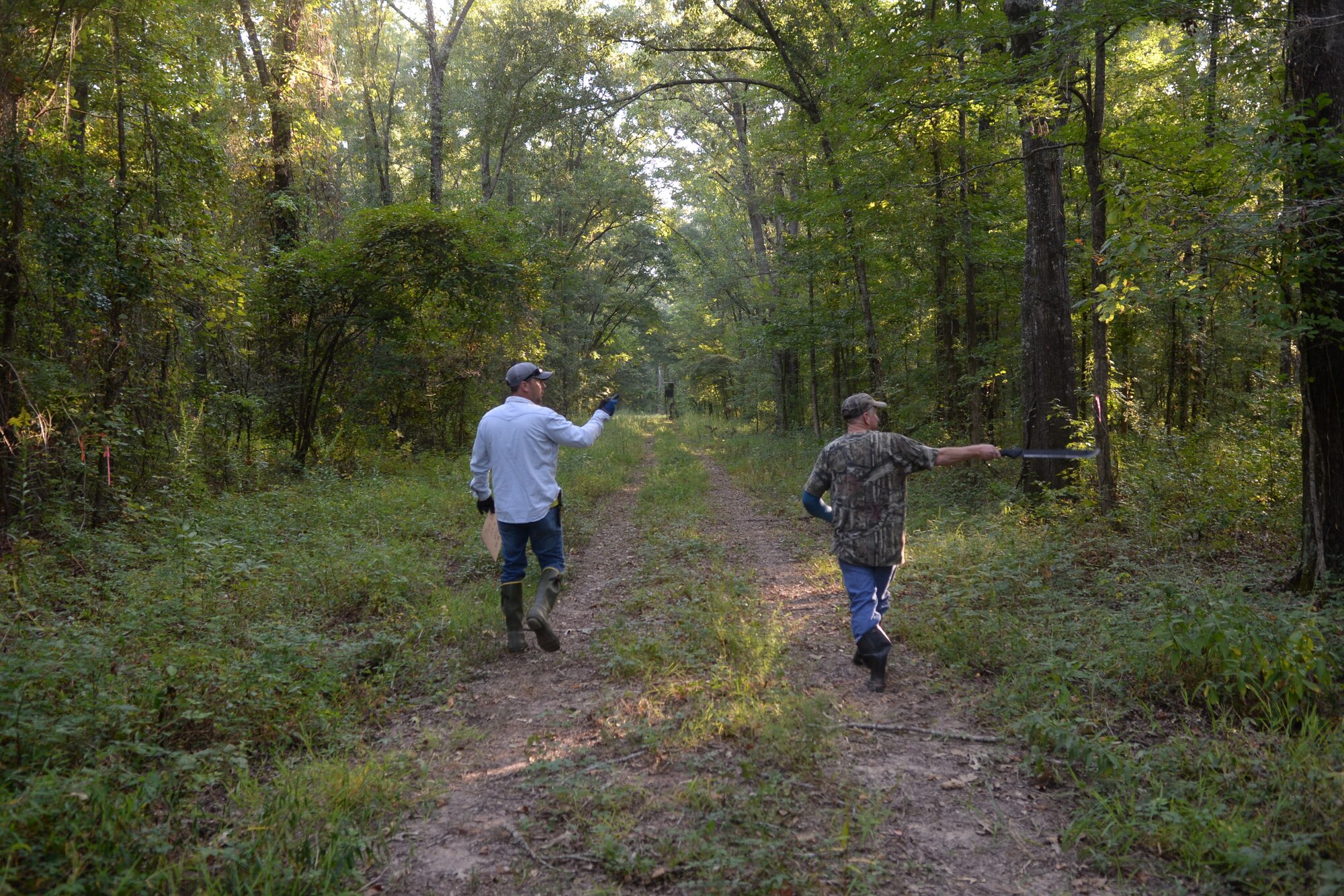 Master Sgt. James Welch, 307th Safety explosives safety manager, and Tech. Sgt. David Bailey, 307th Aircraft Maintenance Squadron B-52 Stratofortress crew chief, search for a location to claim for the upcoming deer hunting season at Barksdale Air Force Base, La., Sept 15, 2015. Hunters may register a food plot, a pipeline or search the reservation to find a location for their deer hunting stands. (U.S. Air Force photo/Senior Airman Amanda Morris)