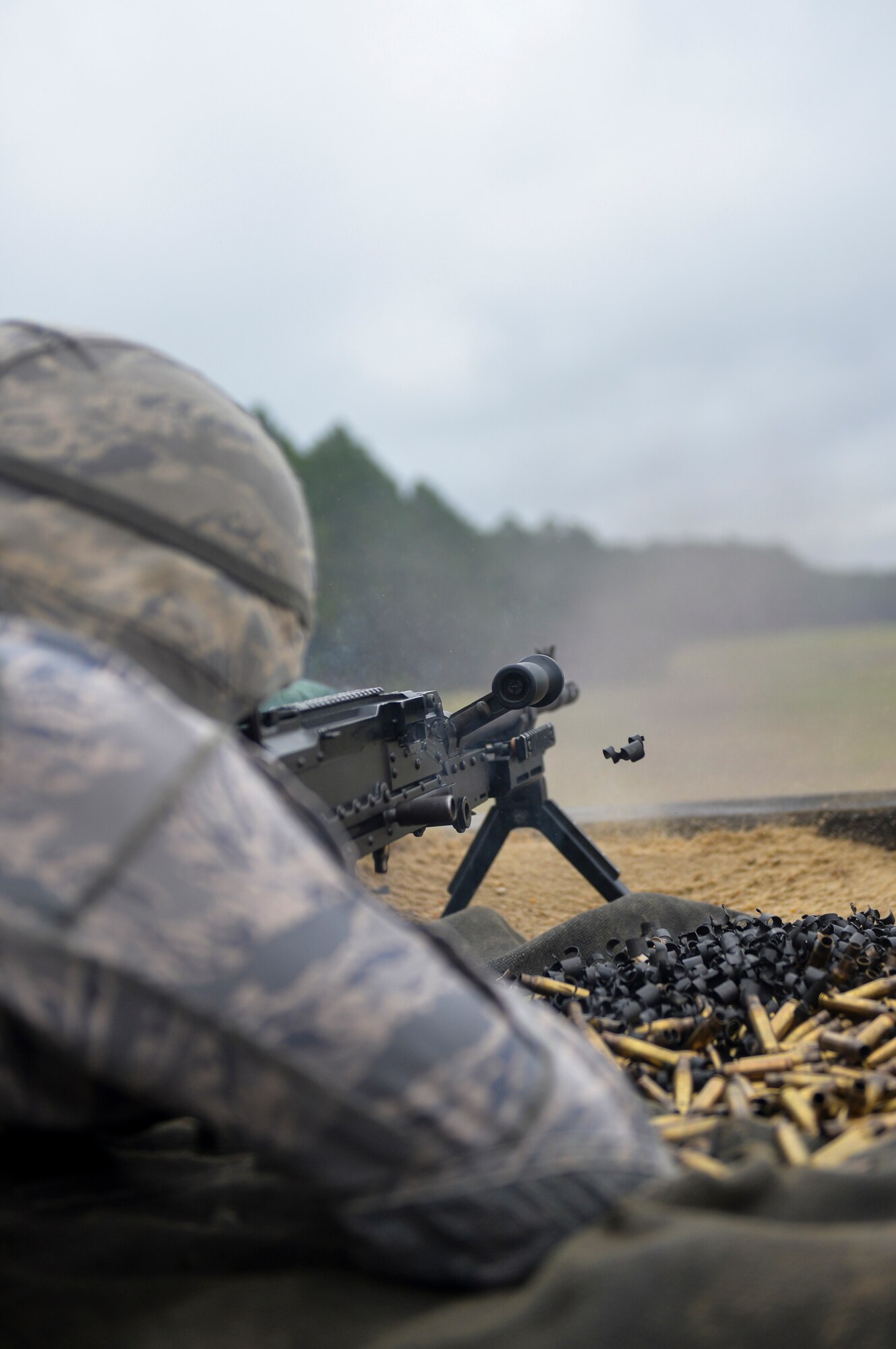 Senior Airman Aaron Wright, 2nd Security Forces Squadron installation patrolman, fires an M240 light machine gun in preparation for the 2015 Global Strike Challenge at Fort Polk, La., Sept. 11. The M240 is a belt-fed, air-cooled, gas-operated 7.62mm fully automatic weapon and has been in service with the U.S. military since the 1970s. (U.S. Air Force photo/Airman 1st Class Mozer Da Cunha)