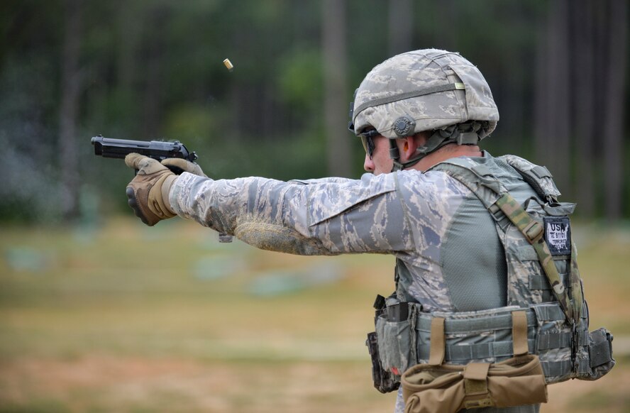 Senior Airman Kenneth Burdick, 2nd Security Forces Squadron installation patrolman, fires an M9 pistol in preparation for the 2015 Global Strike Challenge at Fort Polk, La., Sept. 11. Security Forces Airmen showcased their diverse skill sets firing different weapons such as the M9 pistol, M4 carbine, M240 light machine gun and the M203 grenade launcher. (U.S. Air Force photo/Airman 1st Class Mozer Da Cunha)