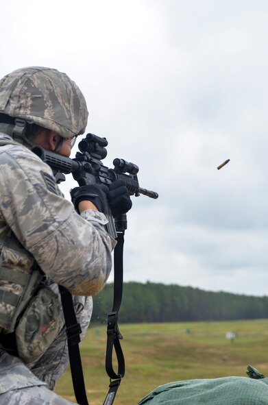 Staff Sgt. Gabriel Larrazabal, 2nd Security Forces Squadron NCO in charge of plans and programs, fires an M4 carbine from a kneeling position while training for the 2015 Global Strike Challenge at Fort Polk, La., Sept. 11. The M4 is shorter and lighter than the M16A2 assault rifle, but fires the same 5.56mm ammunition heavily used by U.S. Armed Forces. (U.S. Air Force photo/Airman 1st Class Mozer Da Cunha)
