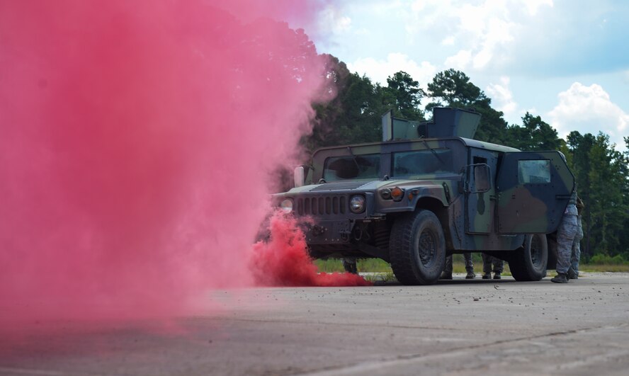 Airmen with the 2nd Security Forces Squadron practice for the Humvee push portion of the 2015 Global Strike Challenge at Barksdale Air Force Base, La., Sept. 17. The Humvee push gave Airmen a chance to improve strength and conditioning while developing tactics and teamwork. (U.S. Air Force photo/Airman 1st Class Mozer Da Cunha)