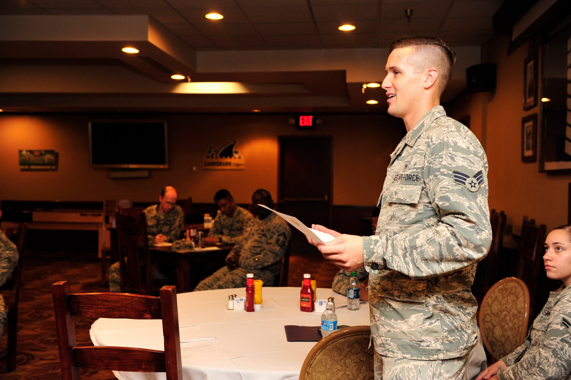 Senior Airman Dylan Vogel, 56th Medical Operations Squadron Family Health medical technician and the Luke Empowering Airmen’s Development Council president, goes over the latest upcoming events during a LEAD Council meeting Sept. 16, 2015 at Luke Air Force Base, Ariz. Club Five Six. The LEAD Council has various programs available to help Airmen succeed, from the shadowing program to the scholarships provided and more. (U.S. Air Force photo by Senior Airman Grace Lee)