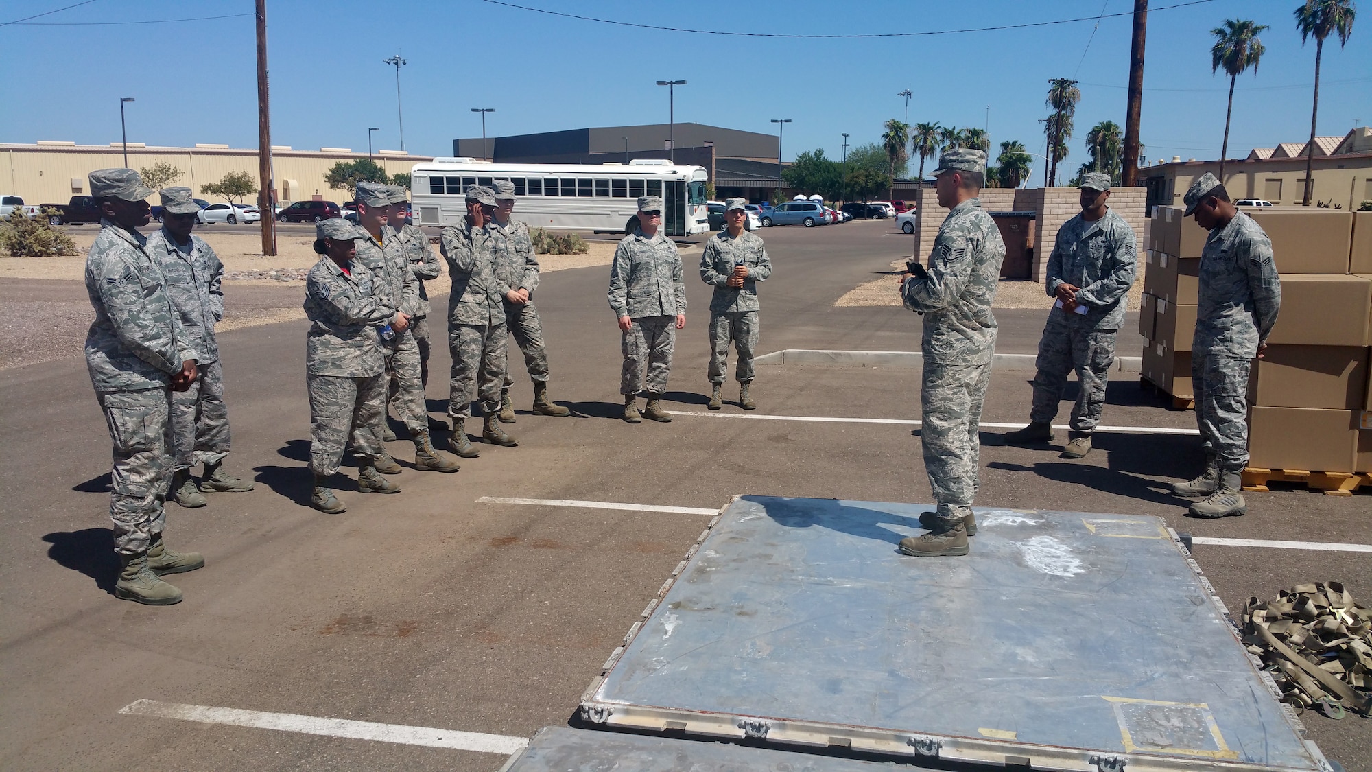 Staff Sgt. Cody Phillips, 56th Logistics Readiness Squadron supervisor of air and transportation, briefs the Immersion Program participants Sept. 11, 2015 at Luke Air Force Base, Ariz. The Immersion Program invites two participants from each of the four 56th Fighter Wing groups and the 56th FW staff agencies, for a total of 10 participants, to explore other jobs at Luke AFB.  (Courtesy Photo)