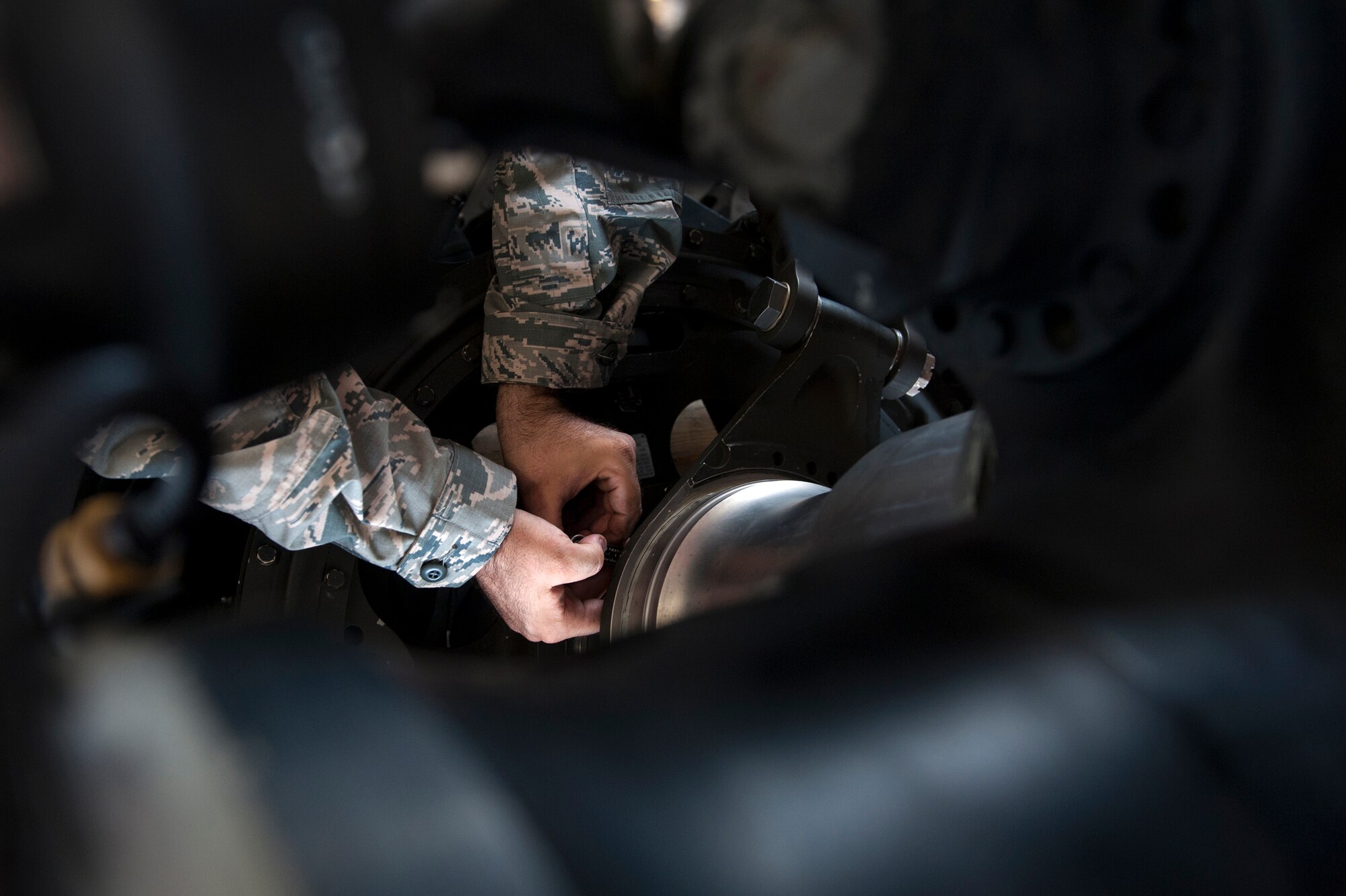 An Airmen with the 41st Helicopter Maintenance Unit  loosens a bolt on an HH-60G Pave Hawk Sept. 22, 2015, at Moody Air Force Base, Ga. Airmen from the 41st HMU work solely on HH-60s at Moody, but are capable of maintaining any type of helicopter or cargo aircraft within the Air Force. (U.S. Air Force photo by Airman 1st Class Kathleen D. Bryant/Released)
