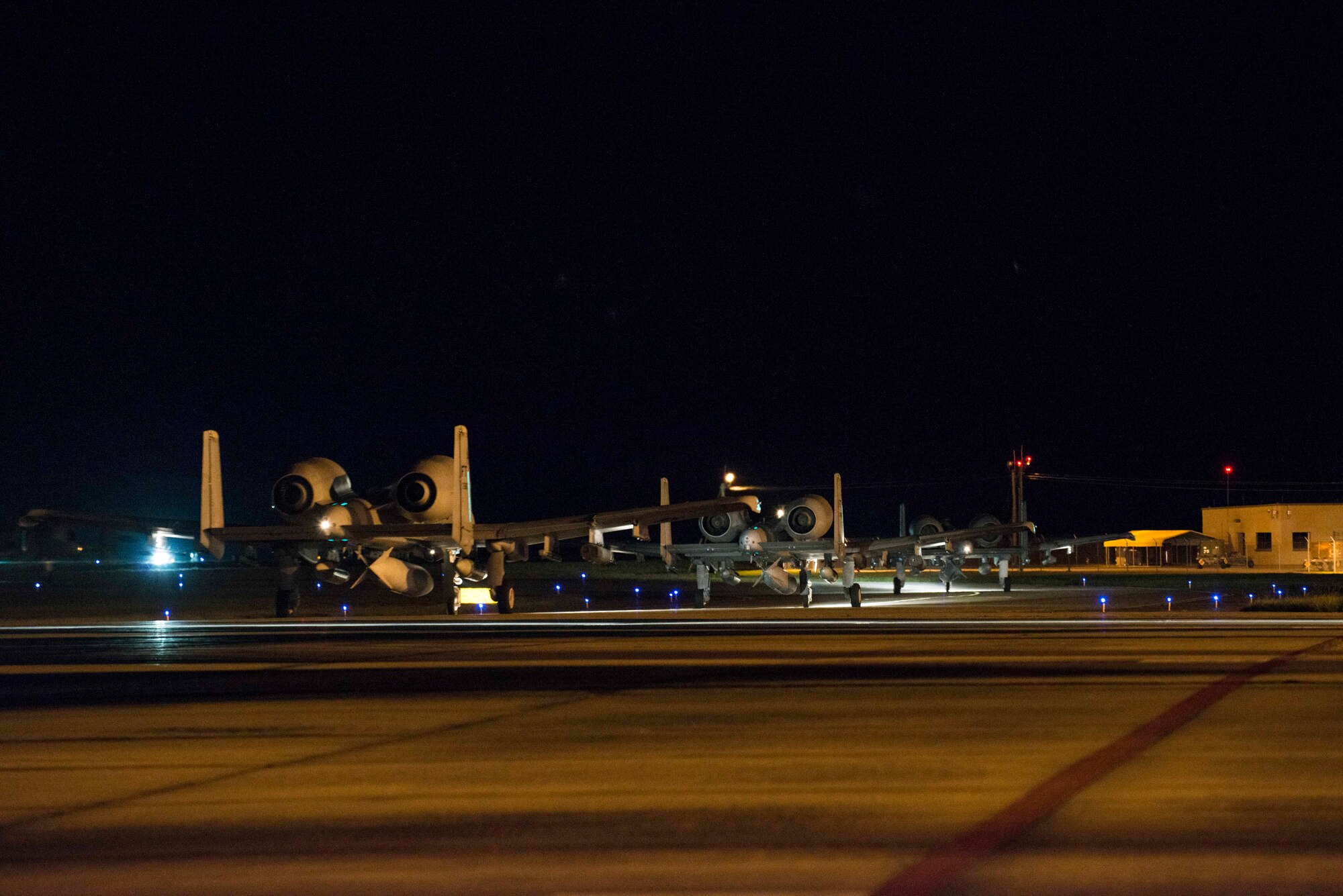 A-10C Thunderbolt IIs taxi on the flightline Sept. 19, 2015, at Moody Air Force Base, Ga. The A-10s departed Moody for Amari Air Base, Estonia, to support Operation Atlantic Resolve to demonstrate commitment to NATO allies. (U.S. Air Force photo by Airman 1st Class Dillian Bamman/Released)