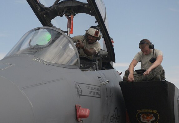 U.S. Air Force Senior Airman Edmund Aldridge, 391st Aircraft Maintenance Unit avionics journeyman points at a part in the F-15E Strike Eagle, July 23, 2015 at Nellis Air Force Base, Nevada. Edmund is one of many avionics technicians' who made sure the jets were operating correctly during Red Flag 15-3. (U.S. Air Force photo by Senior Airman Brittany A. Chase)