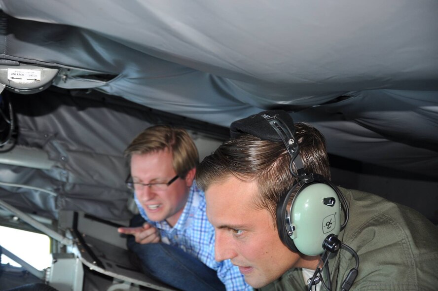 Staff Sgt. Caleb Sieben refuels an E-3 Sentry Airborne Warning and Control System during a boss lift for employers of 927th Air Refueling Win reservists and local civic leaders, Saturday, September 19, 2015. Next to Sieben is Mr. Clint Borm, director of physician relations, Laser Spine Institute and 927th Aerospace Medicine Squadron Honorary Commander. The Boss lift program at MacDill AFB, is a joint program between the 927th ARW and state committee members from the Employer Support of the Guard and Reserve. (U.S. Air Force photo by Capt. Joseph T. Simms)