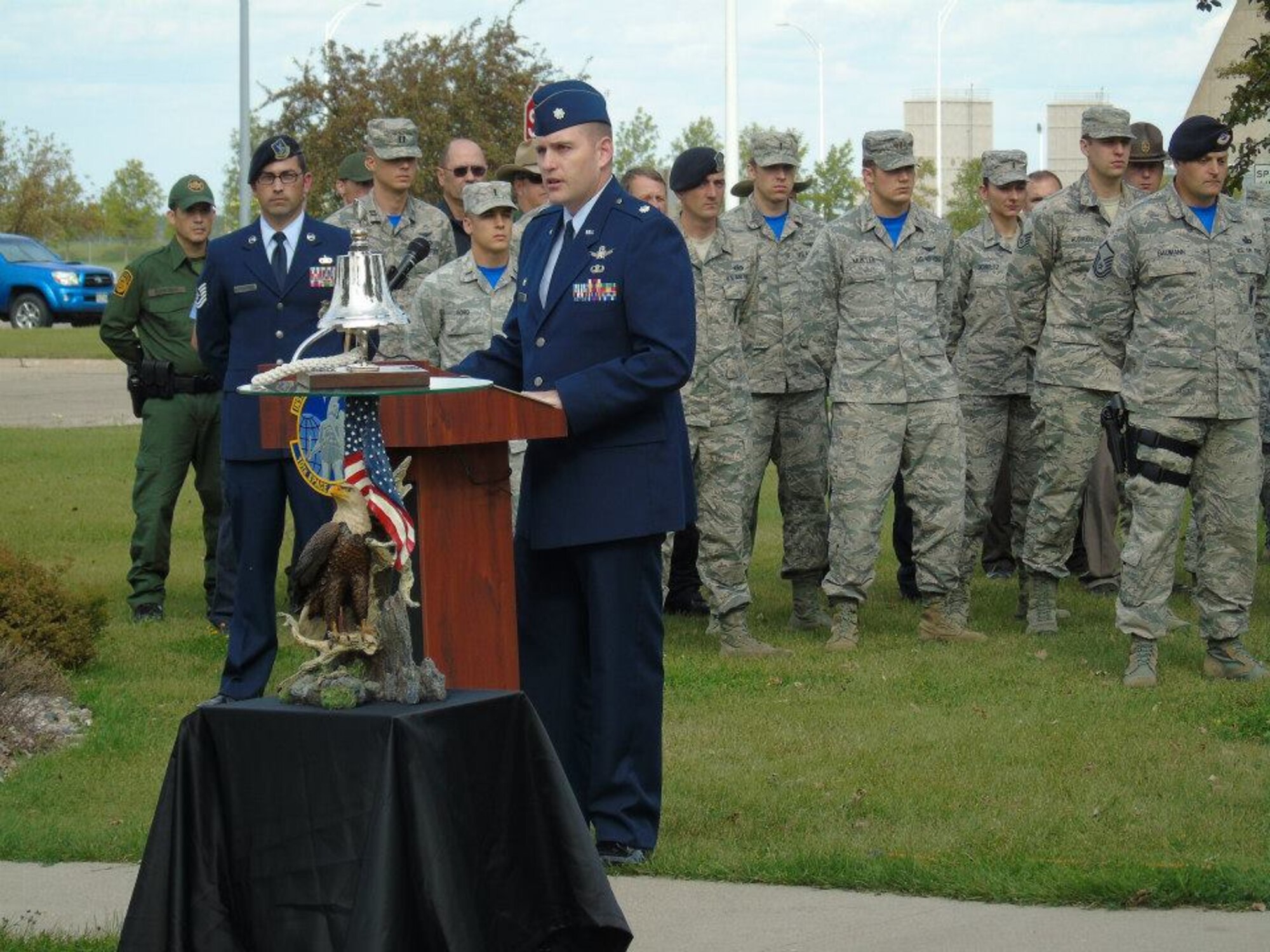 Lt. Col. John Koehler II, 10th Space Warning Squadron commander, speaks at the Patriot Day ceremony on Cavalier Air Force Station, N.D., Sept. 11, 2015. Airmen and local community members gathered to remember the first responders who lost their lives in the Sept. 11, 2001, terrorist attacks. (Courtesy photo by 2nd Lt. Brandy Benesch)