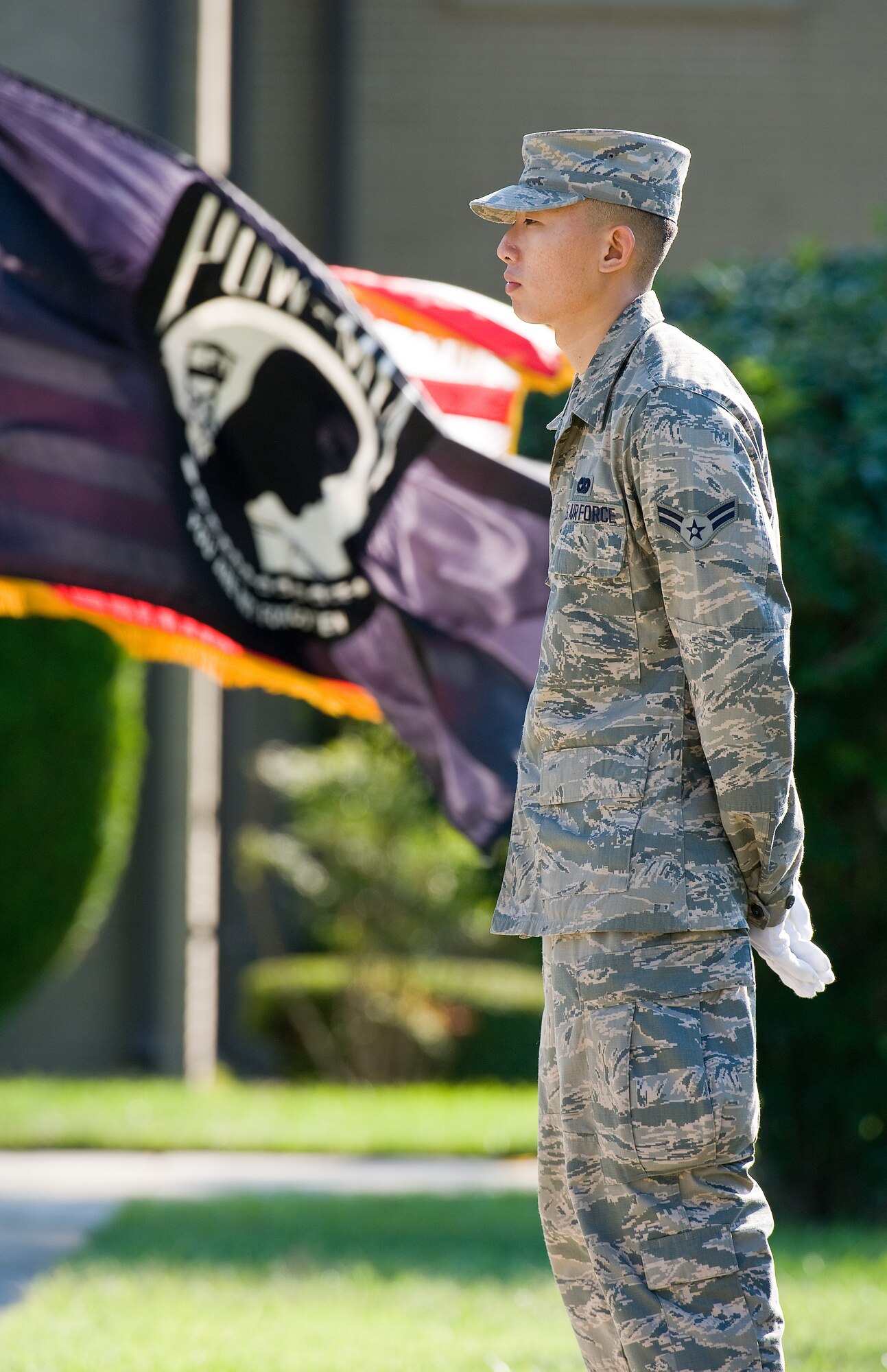 Airman 1st Class Minsoo Goh, 436th Aerial Port Squadron ramp services specialist, stands at parade rest during the National POW/MIA Recognition Day retreat ceremony Sept. 18, 2015, on Dover Air Force Base, Del. Goh, a member of the Base Honor Guard, was part of the flag detail for the retreat ceremony. (U.S. Air Force photo/Roland Balik)