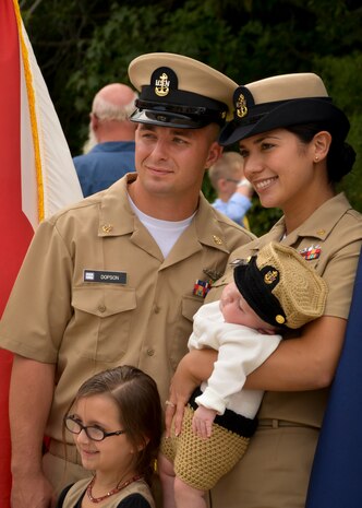 Chief Electronics Technician Clair Dopson poses for a portrait with his family at the Naval Nuclear Power Training Command Fiscal Year 2016 Chief Pinning ceremony September 16, 2015 at Joint Base Charleston - Weapons Station, S.C. Dopson and 28 other sailors were advanced to the rank of Chief Petty Officer during a ceremony representing more than a century of heritage and tradition. (U.S. Navy photo/Mass Communication Specialist 2nd Class Jason Pastrick)