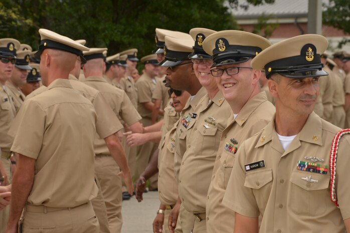 Naval Nuclear Power Training Command (NNPTC) Chief Petty Officers congratulate and welcome newly pinned Chiefs at the NNPTC Fiscal Year 2016 Chief Pinning Ceremony September 16, 2015 at Joint Base Charleston - Weapons Station, S.C. With the time-honored tradition and heritage of being a Chief also comes great responsibility as the Navy’s newest deck plate leaders and mentors.  (U.S. Navy photo/Mass Communication Specialist 2nd Class Jason Pastrick)