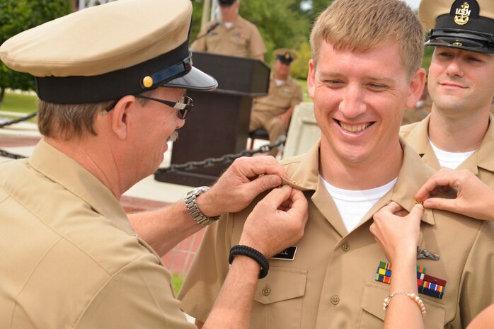 Naval Nuclear Power Training Command (NNPTC) Staff Member Chief Machinist’s Mate (Select) Jake Crowell is pinned and advanced to Chief Petty Officer at the Fiscal Year 2016 Chief Pinning Ceremony September 16, 2015 at Joint Base Charleston - Weapons Station, S.C. Family and friends watched as 29 Sailors participated in the ceremony representing more than a century of heritage and tradition. (U.S. Navy photo/Mass Communication Specialist 2nd Class Jason Pastrick)