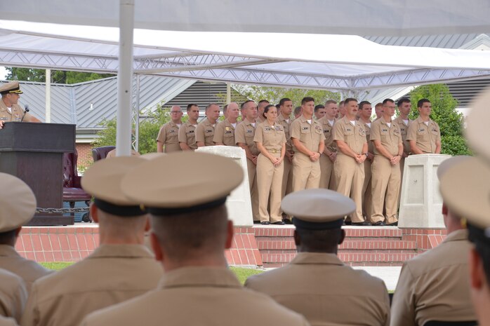 Fellow Chiefs, staff, family and friends watch as the Naval Nuclear Power Training Command Fiscal Year 2016 Chief Selects are advanced to the rank of Chief Petty Officer, September 16, 2015. The ceremony recognized 29 Sailors as they donned anchors representing more than a century of heritage and tradition. (U.S. Navy photo/Mass Communication Specialist 2nd Class Jason Pastrick)