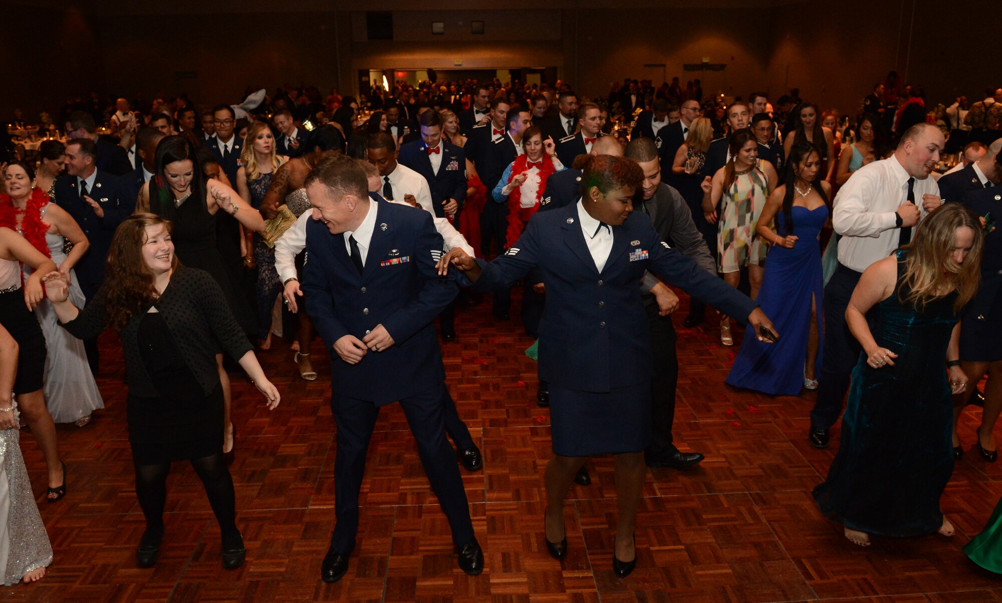 Attendees to the McChord Field Air Force Ball dance Sept. 18, 2015, at Tacoma, Wash. The Ball had a formal portion that included the presentation of the colors, a POW/MIA table, a speech by Kim Wyman, Washington secretary of state and a cutting of the cake by the oldest and youngest Airmen in attendance. (U.S. Air Force photo/ Staff Sgt. Tim Chacon)