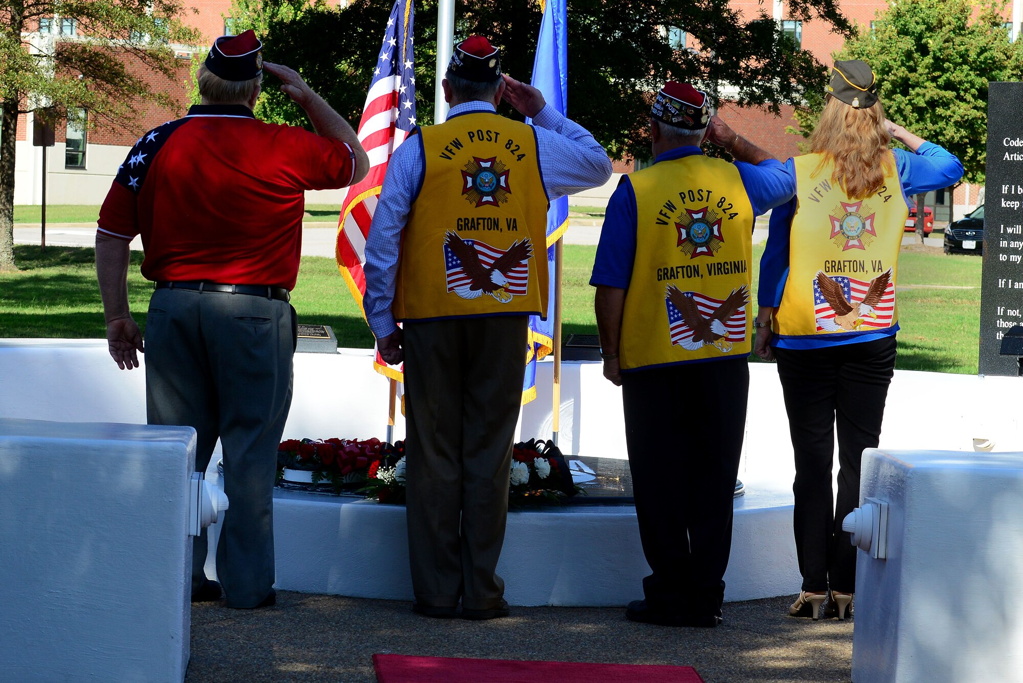 Members of the Veterans of Foreign Affairs Post 824 salute after laying a wreath during the Joint Base Langley-Eustis, Va., Prisoner of War/Missing in Action Recognition Day Ceremony at Langley Air Force Base, Va., Sept. 18, 2015. POW/MIA Recognition day is honored every third Friday of September. (U.S. Air Force photo by Senior Airman Kimberly Nagle/Released)

