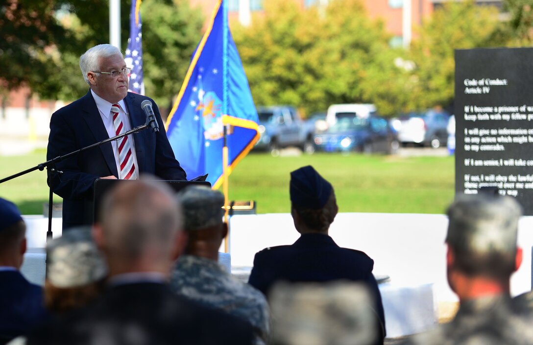 Retired U.S. Air Force Lt. Gen. Glen “Wally” Moorhead III, guest speaker, addresses a crowd during the Joint Base Langley-Eustis, Va., Prisoner of War/Missing in Action Recognition Day Ceremony at Langley Air Force Base, Va., Sept. 18, 2015. Moorhead reflected on his time in the service and shared stories of POW/MIAs, including his father’s personal account. . (U.S. Air Force photo by Senior Airman Kimberly Nagle/Released) 

