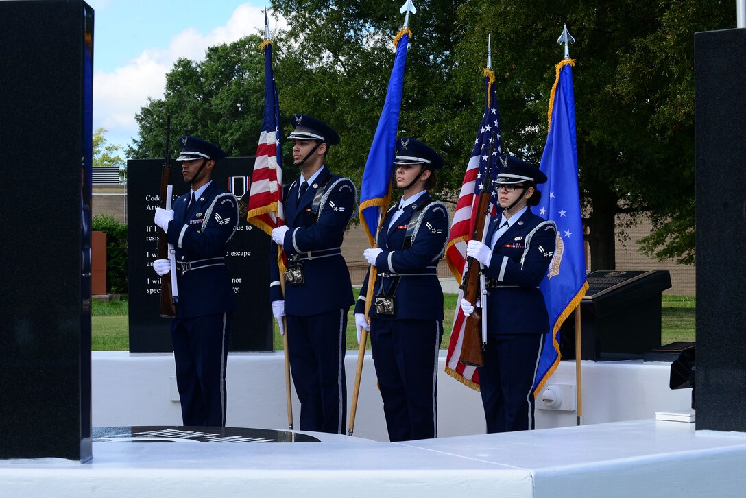 Members of the Langley Honor Guard present the colors during the Joint Base Langley-Eustis, Va., Prisoner of War/Missing in Action Recognition Day Ceremony at Langley Air Force Base, Va., Sept. 18, 2015. The honor guard also took part in the raising of the POW/MIA flag during the ceremony.  (U.S. Air Force photo by Senior Airman Kimberly Nagle/Released)
