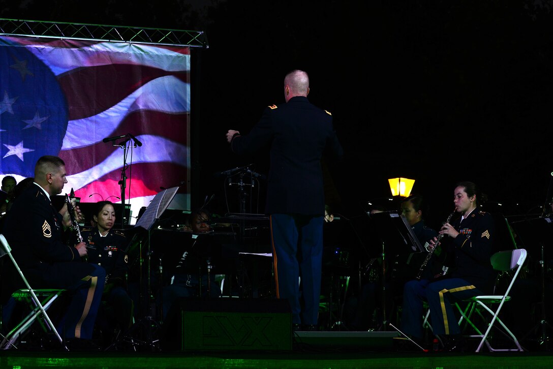 U.S. Army Maj. Randy Bartel, U.S. Army Training and Doctrine Command Band commander, leads the combined TRADOC and U.S. Air Force Heritage of America Bands for the Constitution Day concert in Williamsburg, Va., Sept. 17, 2015. The bands honored this year’s concert theme, Support and Defend, by performing a variety of patriotic music. (U.S Air Force photo by Senior Airman Kimberly Nagle/Released)