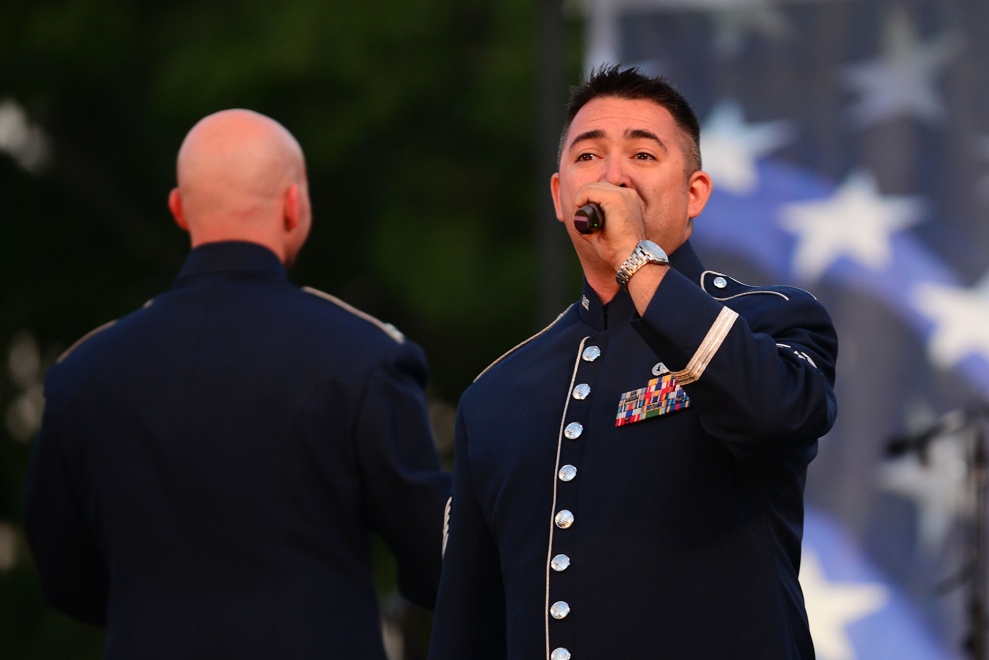 U.S. Air Force Tech. Sgt. Justin Allen, U.S. Air Force Heritage of America Band vocalist, sings during the Constitution Day concert in Williamsburg, Va., Sept. 17, 2015. The event featured a combined ensemble of the U.S. Army Training and Doctrine Command Band and the U.S. Air Force Heritage of America Band, as well as the Colonial Williamsburg Fifes and Drums Corps. (U.S. Air Force photo by Senior Airman Kimberly Nagle/Released)