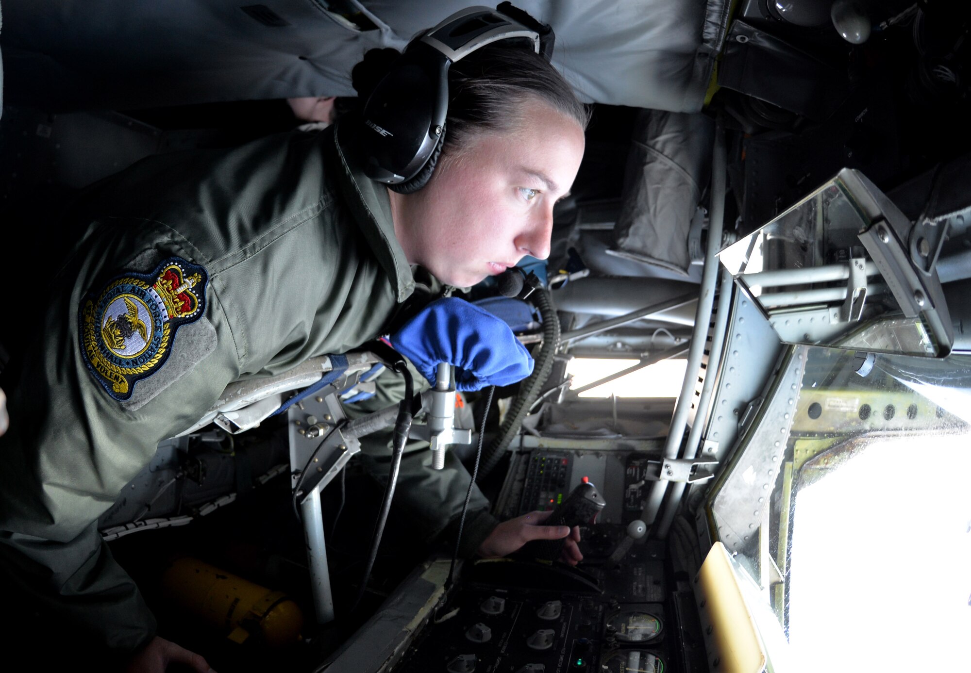 U.S. Air Force Senior Airman Danielle Repp, a KC-135 Stratotanker boom operator assigned to the 351st Air Refueling Squadron, RAF Mildenhall, England, delivers fuel to a B-52 Stratofortress from Barksdale Air Force Base, Louisiana, Sept. 18, 2015 in the skies over Spain. The refueling was part of Operation Immediate Response, which included a three-ship formation of KC-135s delivering a total of 180,000 pounds of fuel to the sole bomber. (U.S. Air Force photo by Tech. Sgt. Austin M. May/Released)