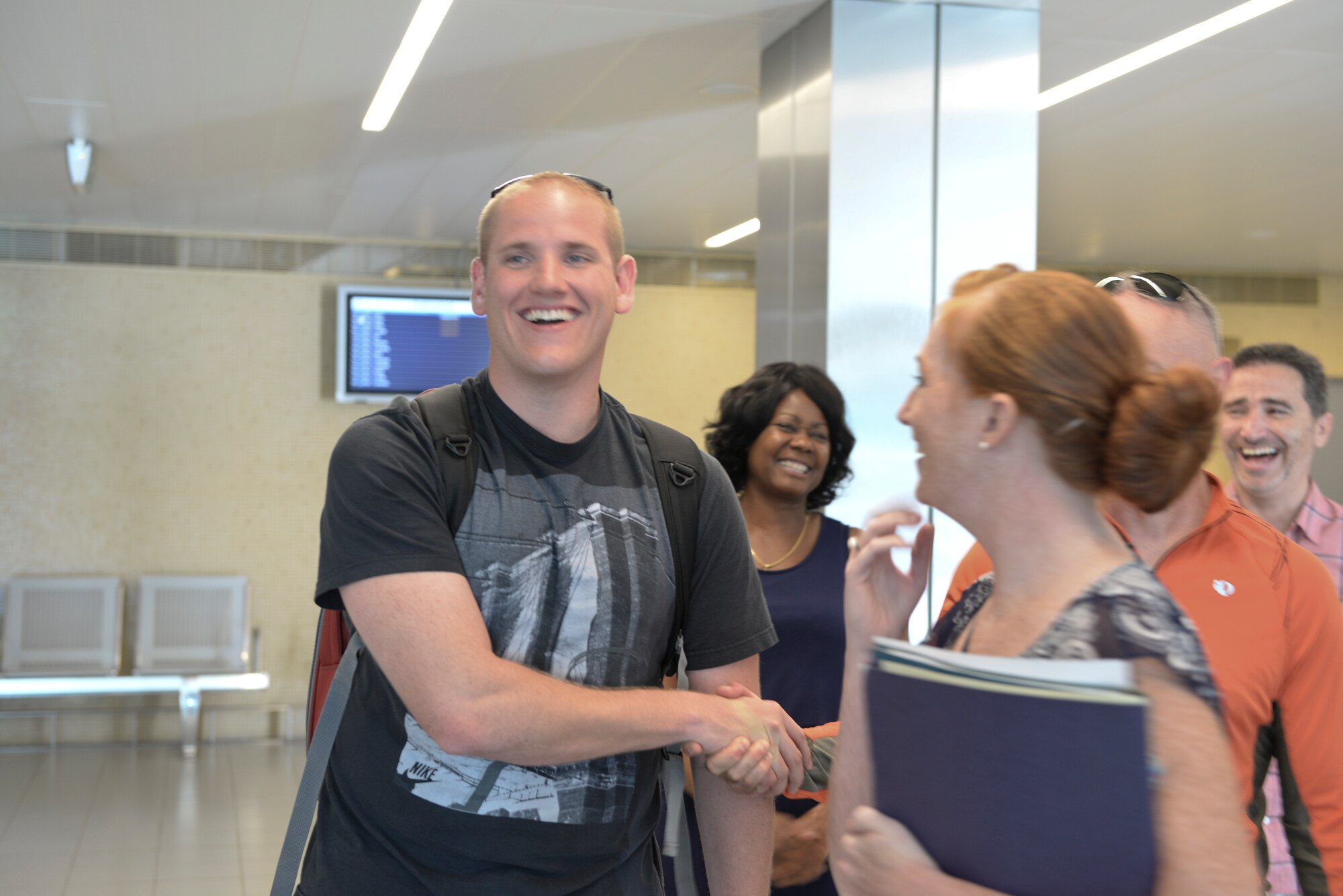 Airman 1st Class Spencer Stone, 65th Medical Operations Squadron ambulance service technician is greeted by Lt. Col. Richard Smith, 65th Air Base Group Medical Operations and Support Squadron commander, and Staff Sgt. Sarah Thomas, 65th Medical Group medical technician,  at Lajes Field. Azores  Sept 22, 2015. Stone, along with childhood friends Aleksander Skarlatos and Anthony Sadler, was recently honored by U.S. President Barack Obama at the White House for subduing an armed gunman when he entered their train carrying an assault rifle, a handgun and a box cutter.  Stone is returning to his home unit for the first time in nearly a month after receiving medical care and traveling throughout the U.S. after the Paris train attack incident.   (U.S Air Force photo/1st Lt. Alexandra Trobe). 